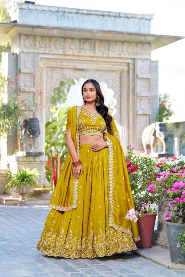 lnb - 1415   lnb 1415 thread embroidery work haldi special lehenga supplier surat 4 2025 06 02 16 03 49.jpg lnb 1415 thread embroidery work haldi special lehenga supplier surat Catalogue Name : 2nd Jun 2025 Name of Product : lnb - 1415  No of Design : 1 Piece (MOQ : 1 Set) Product Rate Per Piece : ₹ 1800 / Per Piece Product Full Catalogue Rate : ₹ 1800 (GST Extra) Full Catalogue Weight : 1 KG Product Type & Size: semi stitched Product Details: 
					 Wedding Collection 2025

A warm embrace of mustard and artistry 
 
LNB1415MST

Lehenga (Stitched)
Lehenga Fabric :  Vichitra Silk 
Lehenga work : Sequins and Thread Embroidery Work 
Lehenga Waist : SUPPORTED UP TO 42
Lehenga Closer : Drawstring with Zip 
Stitching : Stitched With Canvas and Can Can 
Length : 41
Flair : 3.5 Meter
Inner : Micro Cotton

Blouse (Unstitched)
Blouse Fabric :  Vichitra Silk 
Blouse Work : Sequins and Thread Embroidery Work 
Blouse Length : 1 Meter 

Dupatta
Dupatta Fabric :  Vichitra Silk   
Dupatta Work : Sequins and Thread Embroidery Work  Lace Border With Sequins Butties All Over  
Dupatta Length : 2.4 Meter

Package Contain: Lehenga, Blouse, Dupatta, Drawstring With Zip

Weight : 1.650 Kg

Price : 1800